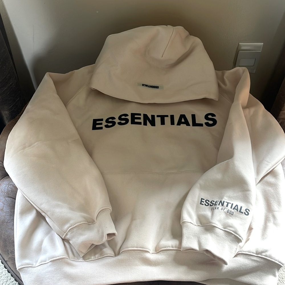 Cream Hoodie with Essentials on the front purchased through Amazon - Size Small